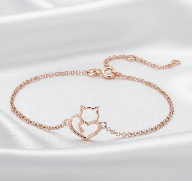 Rose-gold plated cat bracelet on white silk background