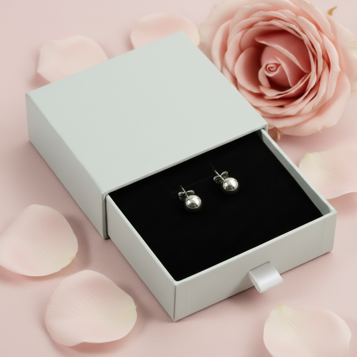 Silver ball stud earrings in grey drawer jewellery box