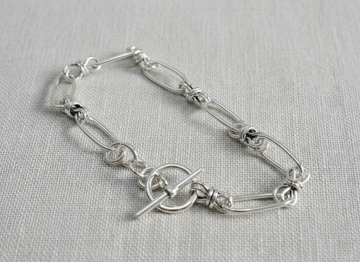 Silver Bracelet on Textured Background