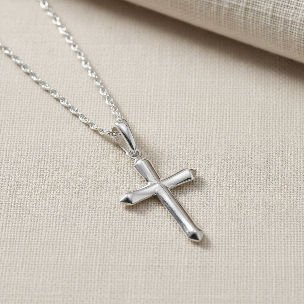 Silver Cross Necklace on Textured Background