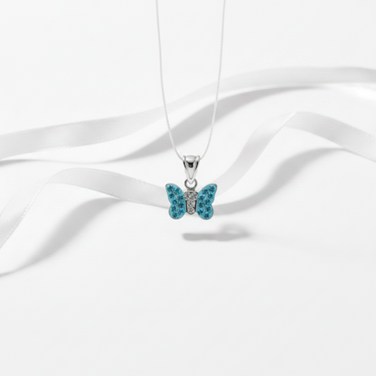 Thin flat pendant blue butterfly crystals on sterling silver with white background